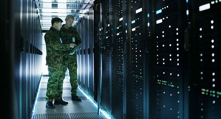 In Data Center Two Military Men Work with Open Server Rack Cabinet. 